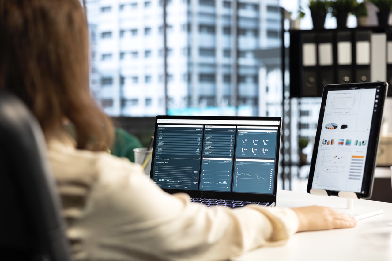 Business leader and trader searching for a new investment solution, examining trading risks and opportunities for company development. Female CEO planning finances and doing research.